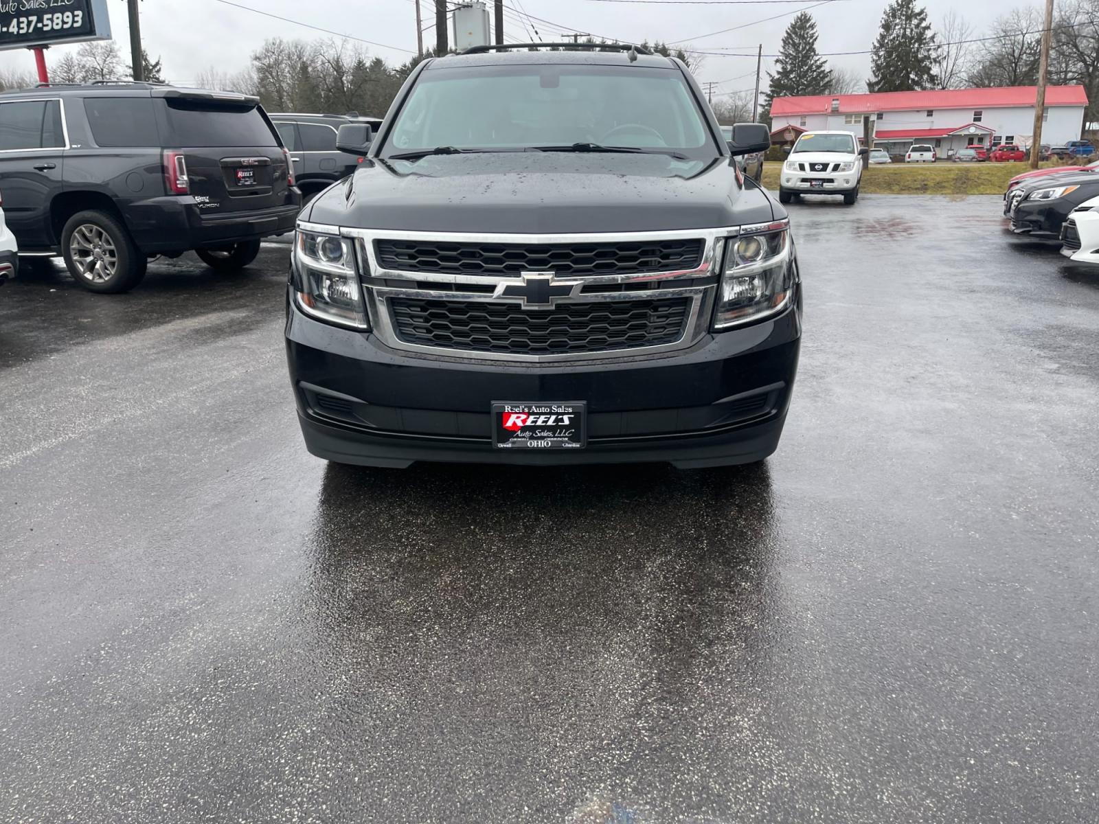 2015 Black /Black Chevrolet Tahoe LS 4WD (1GNSKAEC8FR) with an 5.3L V8 OHV 16V engine, 6-Speed Automatic transmission, located at 547 E. Main St., Orwell, OH, 44076, (440) 437-5893, 41.535435, -80.847855 - This 2015 Chevrolet Tahoe LS 4WD is a versatile and robust full-size SUV that offers a range of comfort and utility features, appealing to families and those needing a capable vehicle for towing and outdoor adventures. Equipped with Tri-Zone Automatic Climate Control, Power Front Seats, and Rain Sen - Photo #1